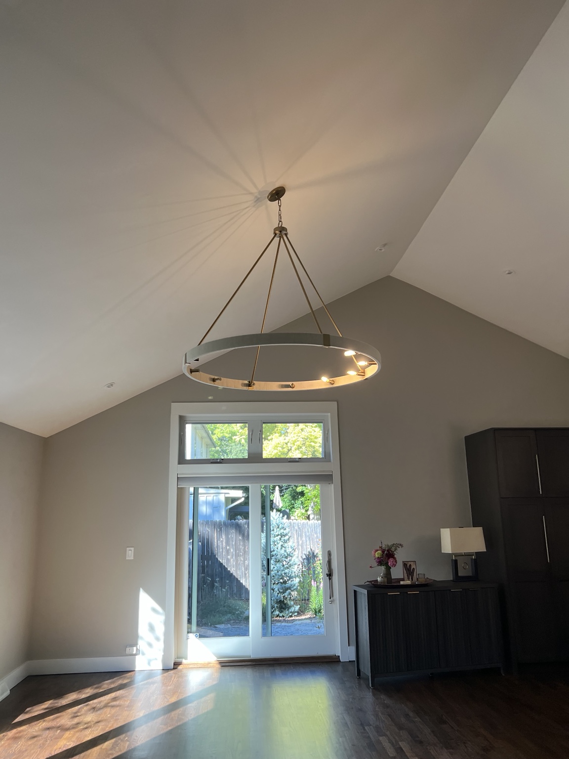 Large decorative chandelier installed in a high ceiling room