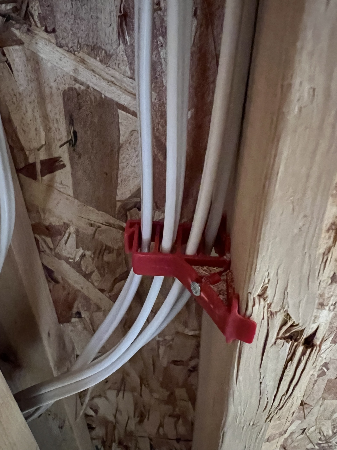 Residential circuit wiring routed through wall framing