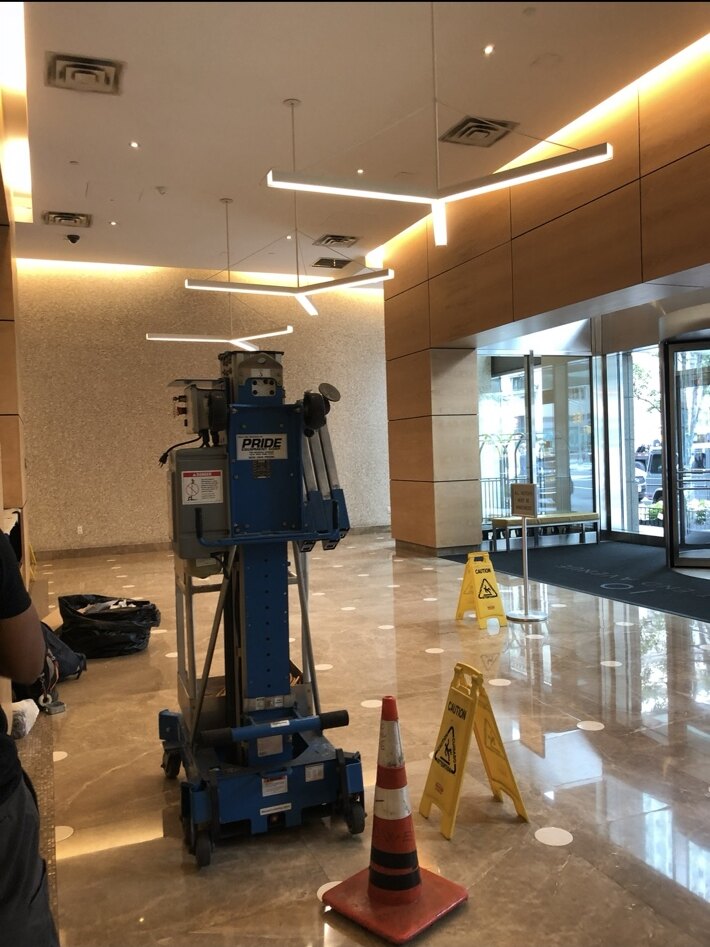 Linear LED fixtures installed in a commercial lobby