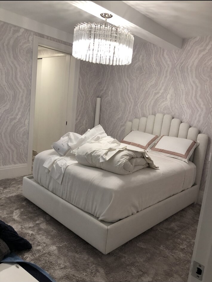 Crystal chandelier installed in a residential bedroom