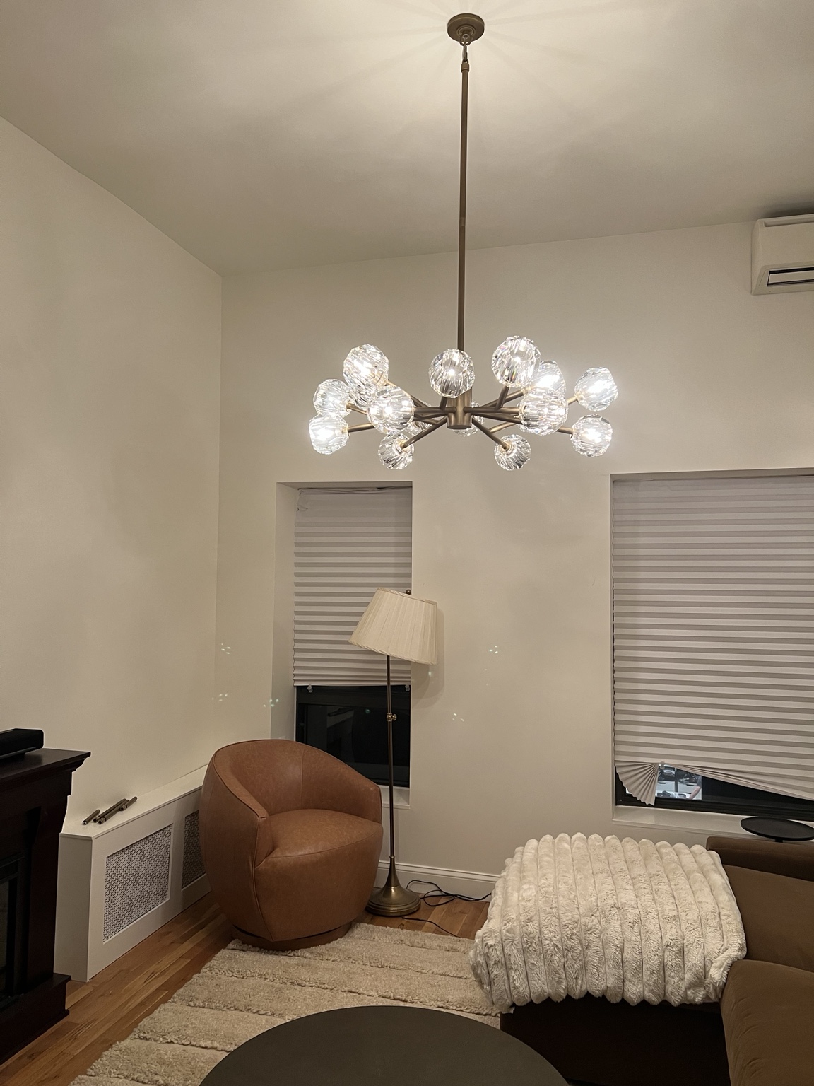 Modern chandelier installed in a living room