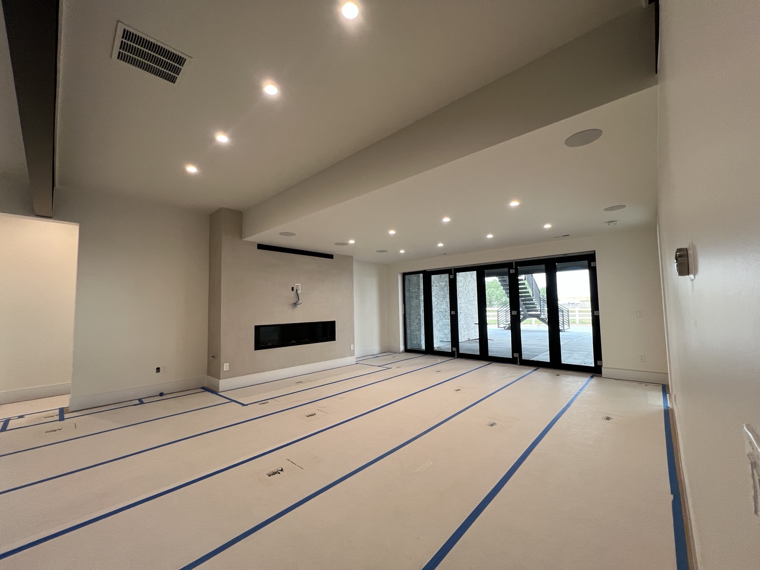 Recessed lighting and ceiling speakers in a remodeled room